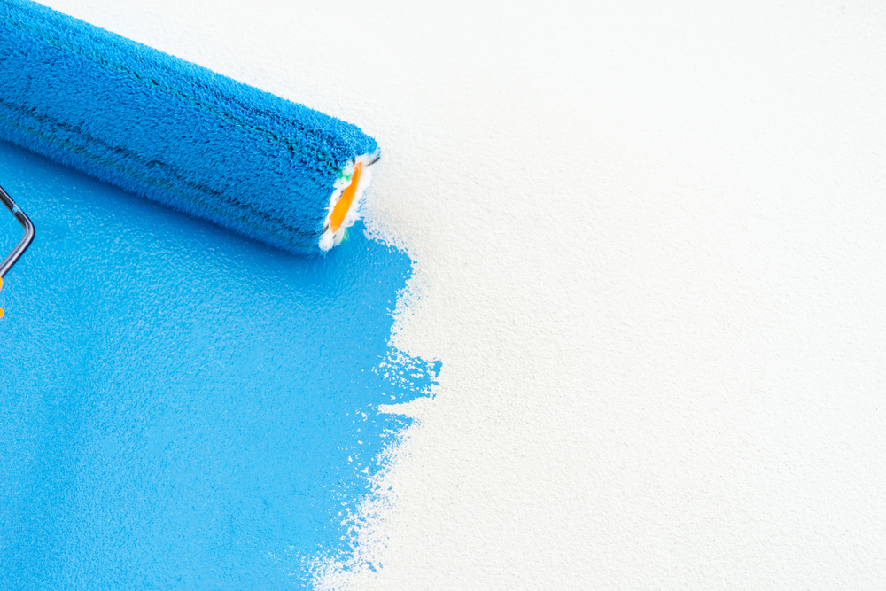 Exterior-house-painting-service-blue-roller-on-white-background